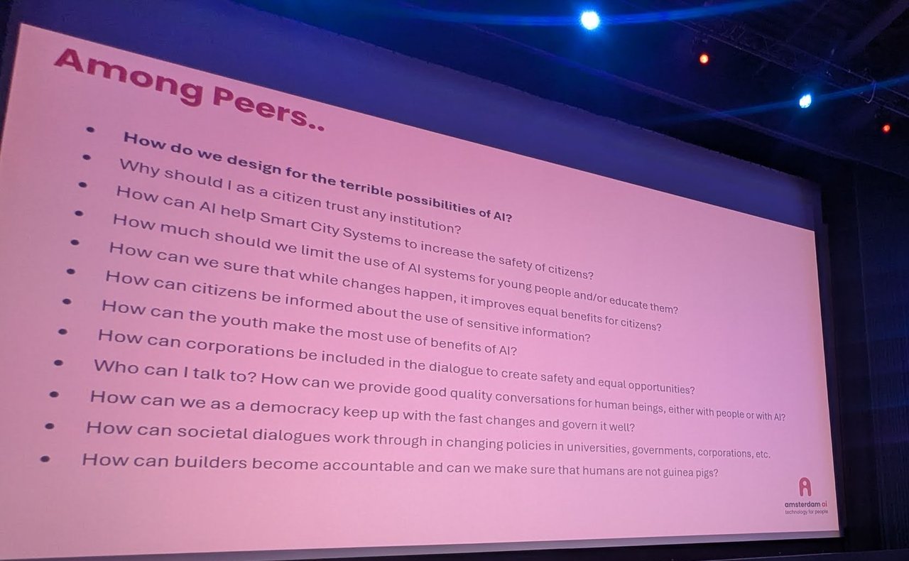 Amsterdam AI slide Among Peers listing questions such as how do we design for the terrible possibilities of AI and how can builders become accountable