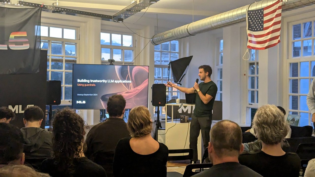 Thomas Vrancken of ML6 presenting the title slide Building trustworthy LLM applications using guardrails at the Google Cloud User Group Amsterdam