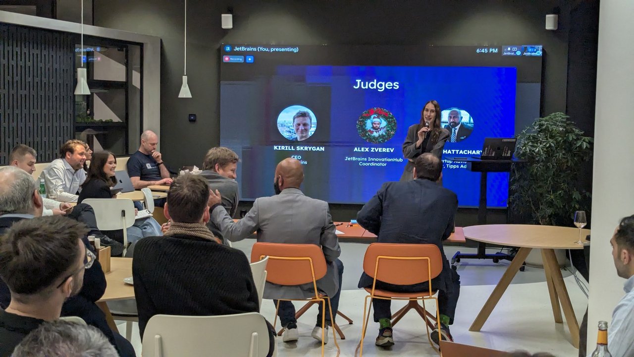 The Judges slide showing Kirill Skrygan, CEO, Alex Zverev, JetBrains InnovationHub Coordinator, and a third judge partly hidden by the host