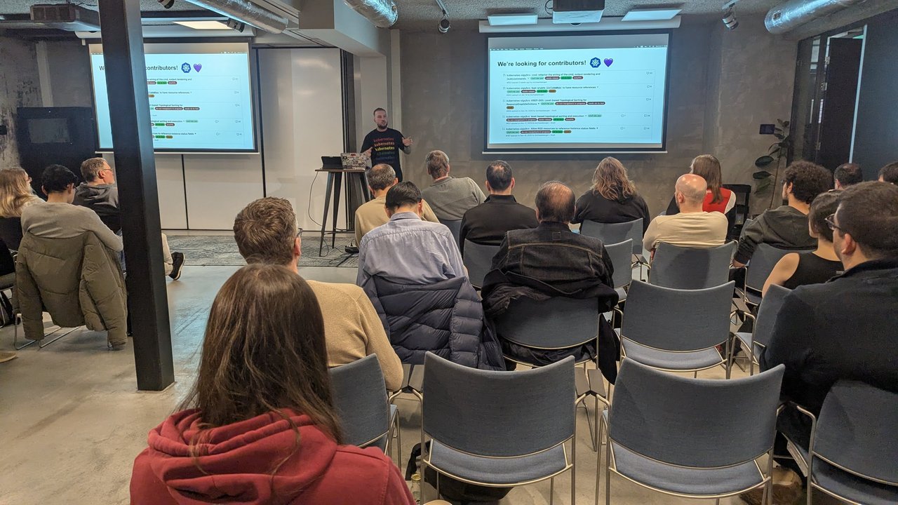A "We're looking for contributors!" slide at the Xebia meetup in Amsterdam, listing open kubernetes-sigs/kro pull requests including KREP-005 level-based topological sorting for ResourceGraphDefinitions