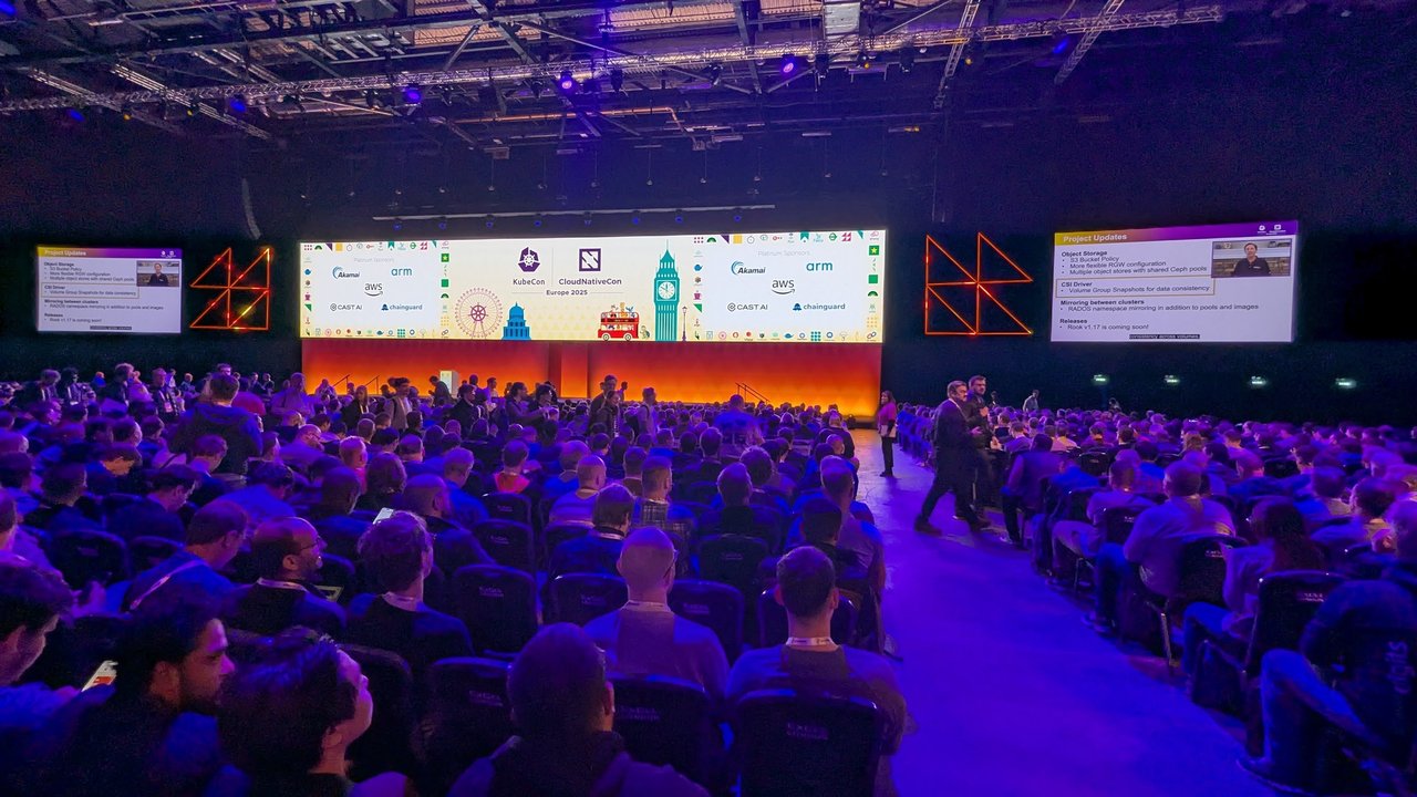 The keynote hall at ExCeL London with a wide stage screen and a full audience