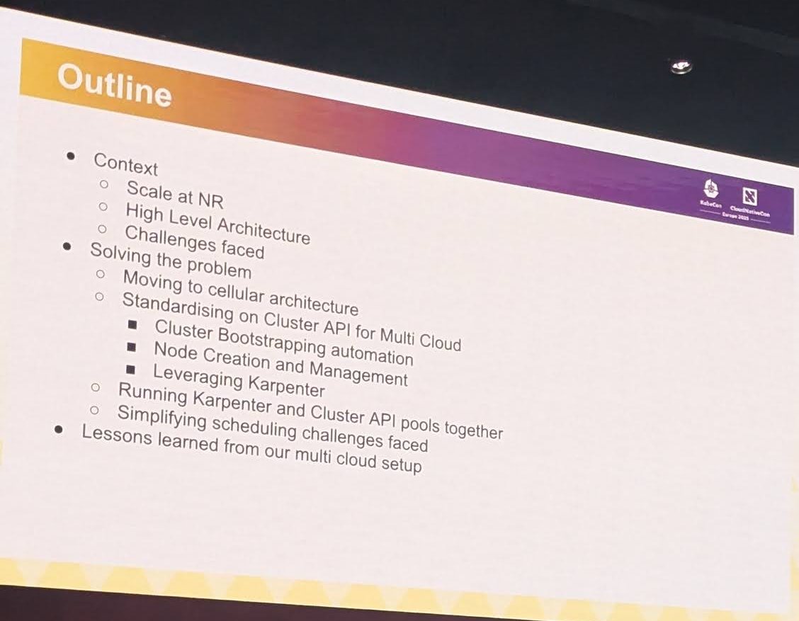 Slide Outline listing context, moving to cellular architecture, standardising on Cluster API for multi cloud, running Karpenter and Cluster API pools together and lessons learned