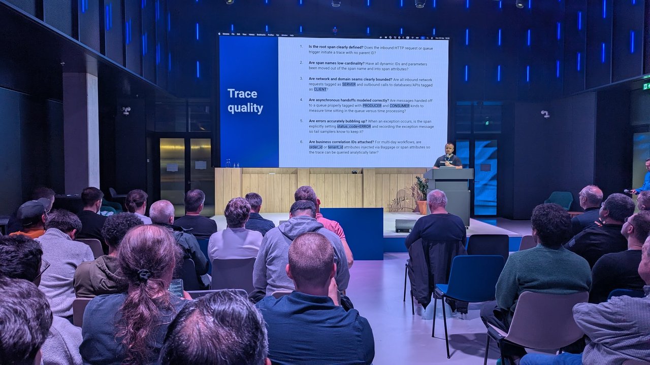 Trace quality checklist slide at Signal Overflow, the SRE NL meetup at Booking.com during KubeCon Europe 2026, covering root spans, low-cardinality span names, span kinds, async handoffs, errors and business correlation IDs