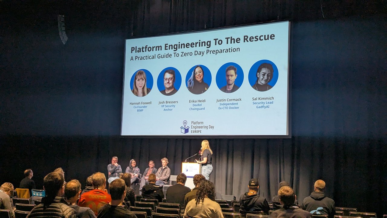 Platform Engineering To The Rescue panel at Platform Engineering Day Europe 2026, with the title slide listing Hannah Foxwell, Josh Bressers, Erika Heidi, Justin Cormack and Sal Kimmich above the seated panel