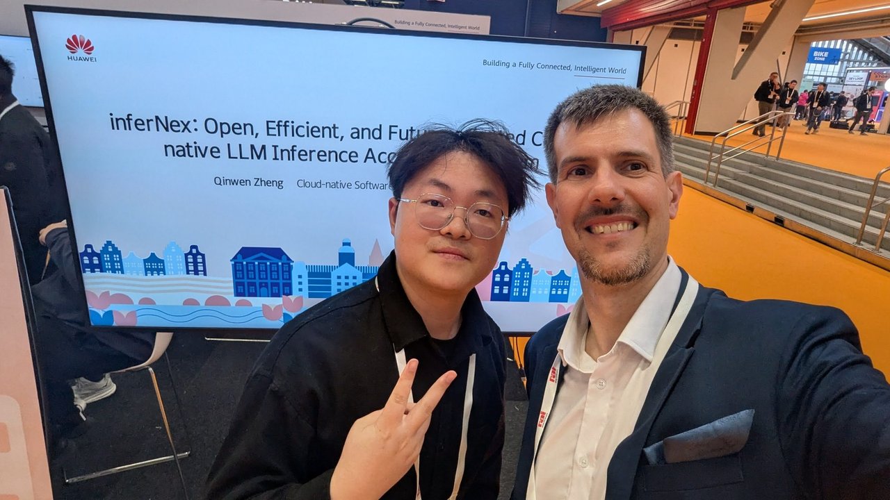 Luca Berton and Qinwen Zheng taking a selfie on the Huawei stand at KubeCon Europe 2026, in front of the title slide of his talk inferNex: Open, Efficient, and Future-oriented Cloud-native LLM Inference Acceleration System