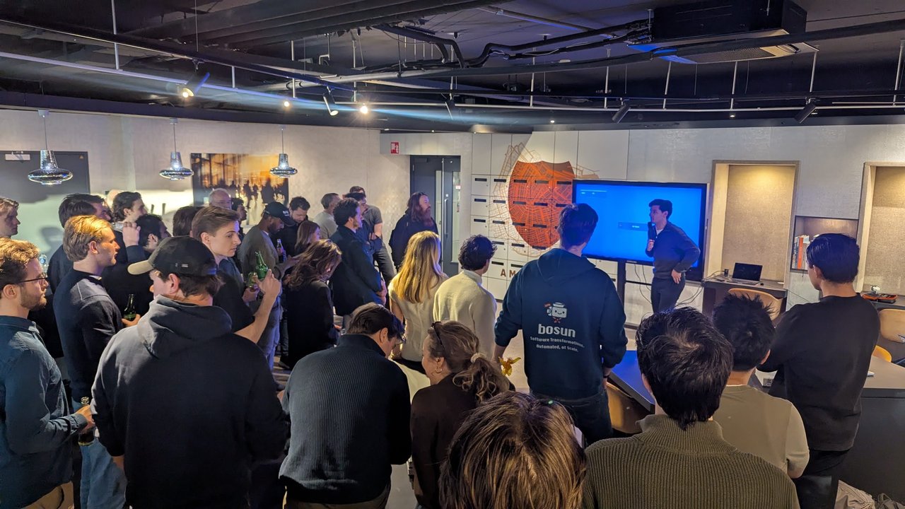 A standing crowd at the AI Foundry office watching the first talk of the 10x engineer meetup