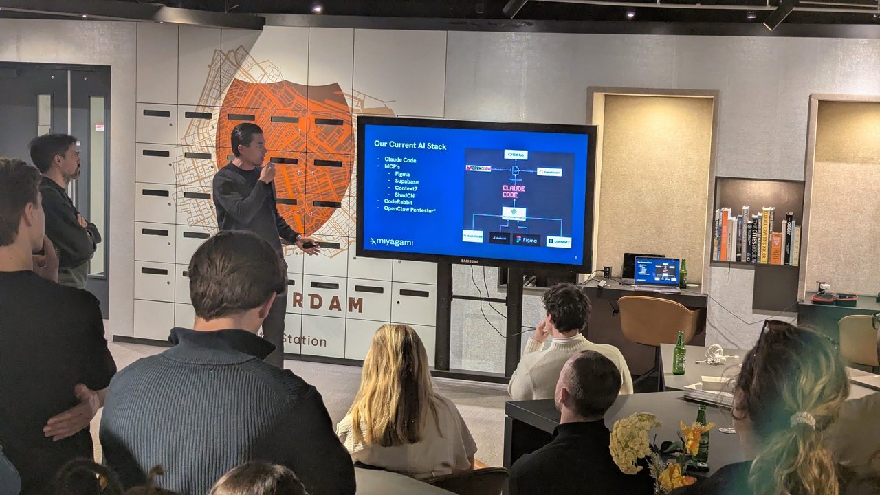 A miyagami speaker presenting Our Current AI Stack: Claude Code, MCPs for Figma, Supabase, Context7 and ShadCN, CodeRabbit and OpenClaw Pentester