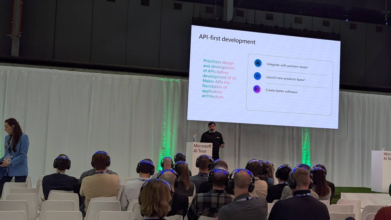 Slide titled API-first development with three points, shown on a screen on the small stage