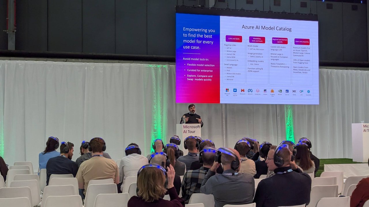 Slide titled Azure AI Model Catalog, Empowering you to find the best model for every use case, with the presenter on the small stage