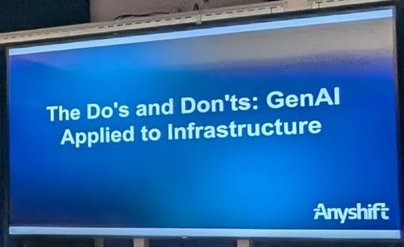 Anyshift title slide 'The Do's and Don'ts: GenAI Applied to Infrastructure' shown on a screen at the Mollie venue