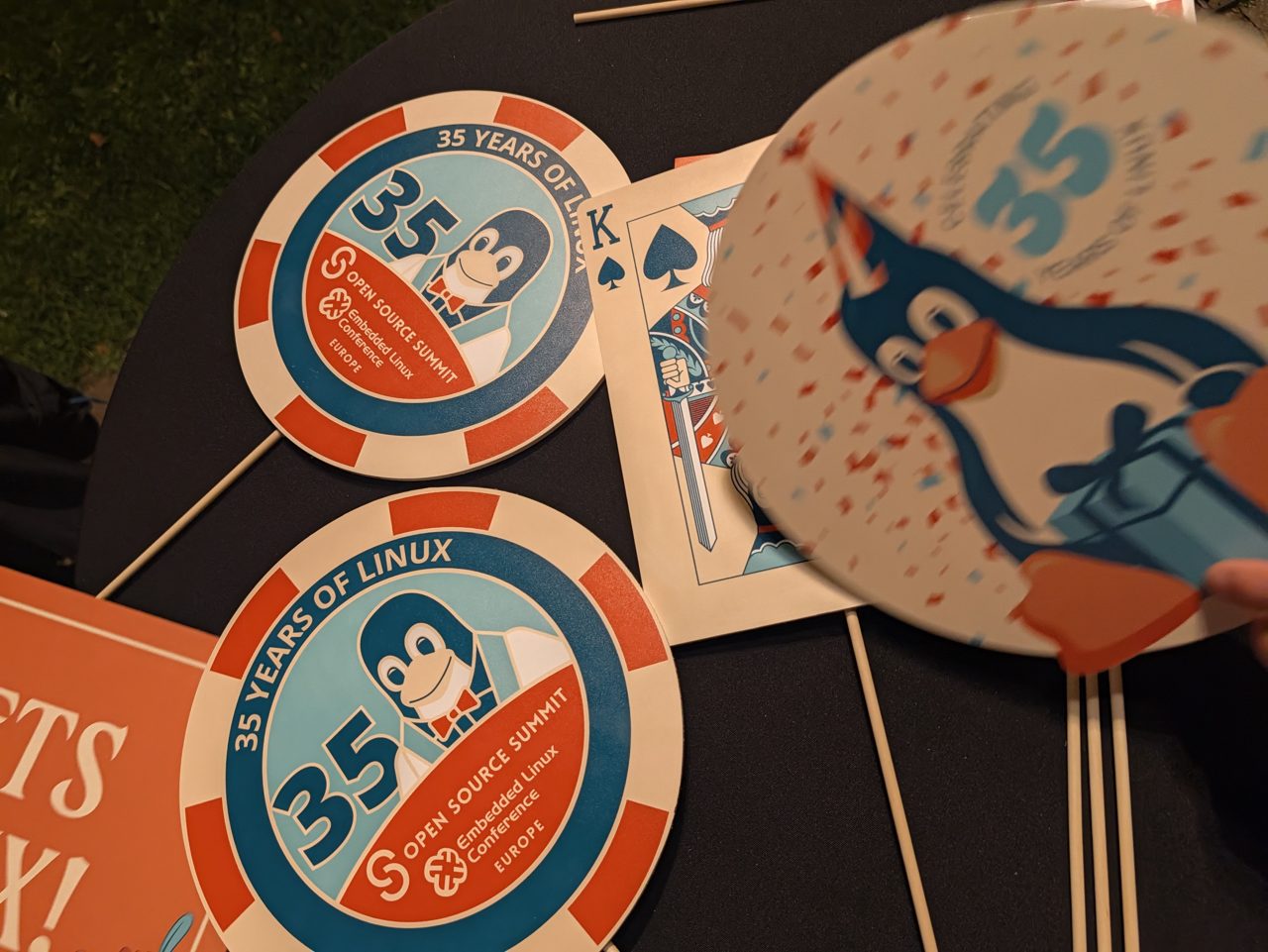 Custom 35 years of Linux casino chips and playing cards