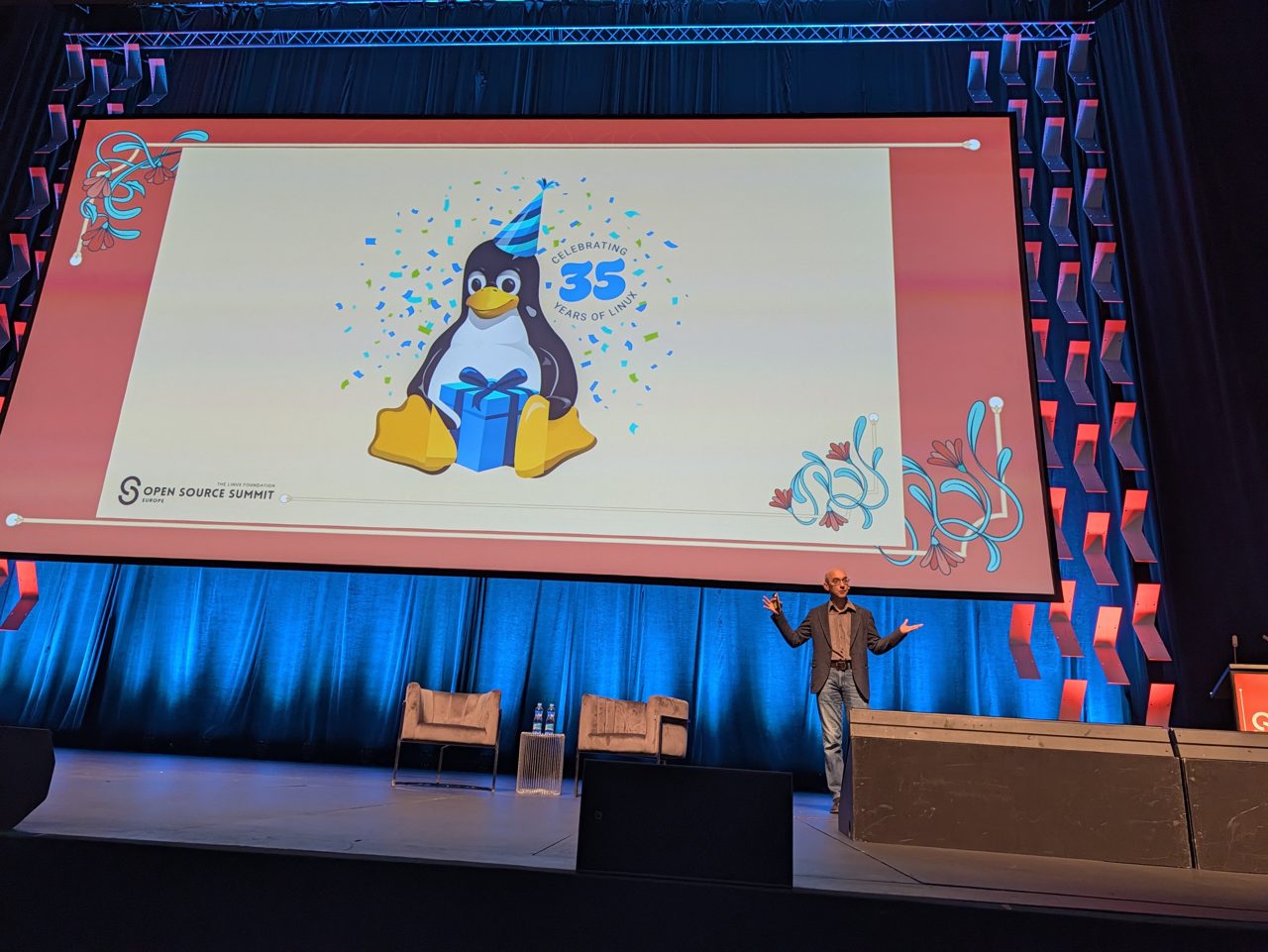 A birthday Tux with a party hat and the number 35 on the Congress Hall screen