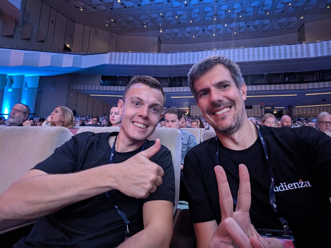Luca Berton with a fellow attendee in the Congress Hall during the security keynotes