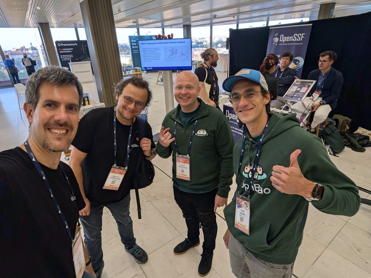 Luca Berton with Marcin Czupryniak, Andrii Fedorchuk and Toni Tauro near the OpenSSF booth
