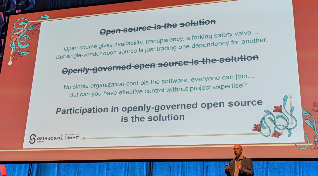 Slide: "Participation in openly-governed open source is the solution"