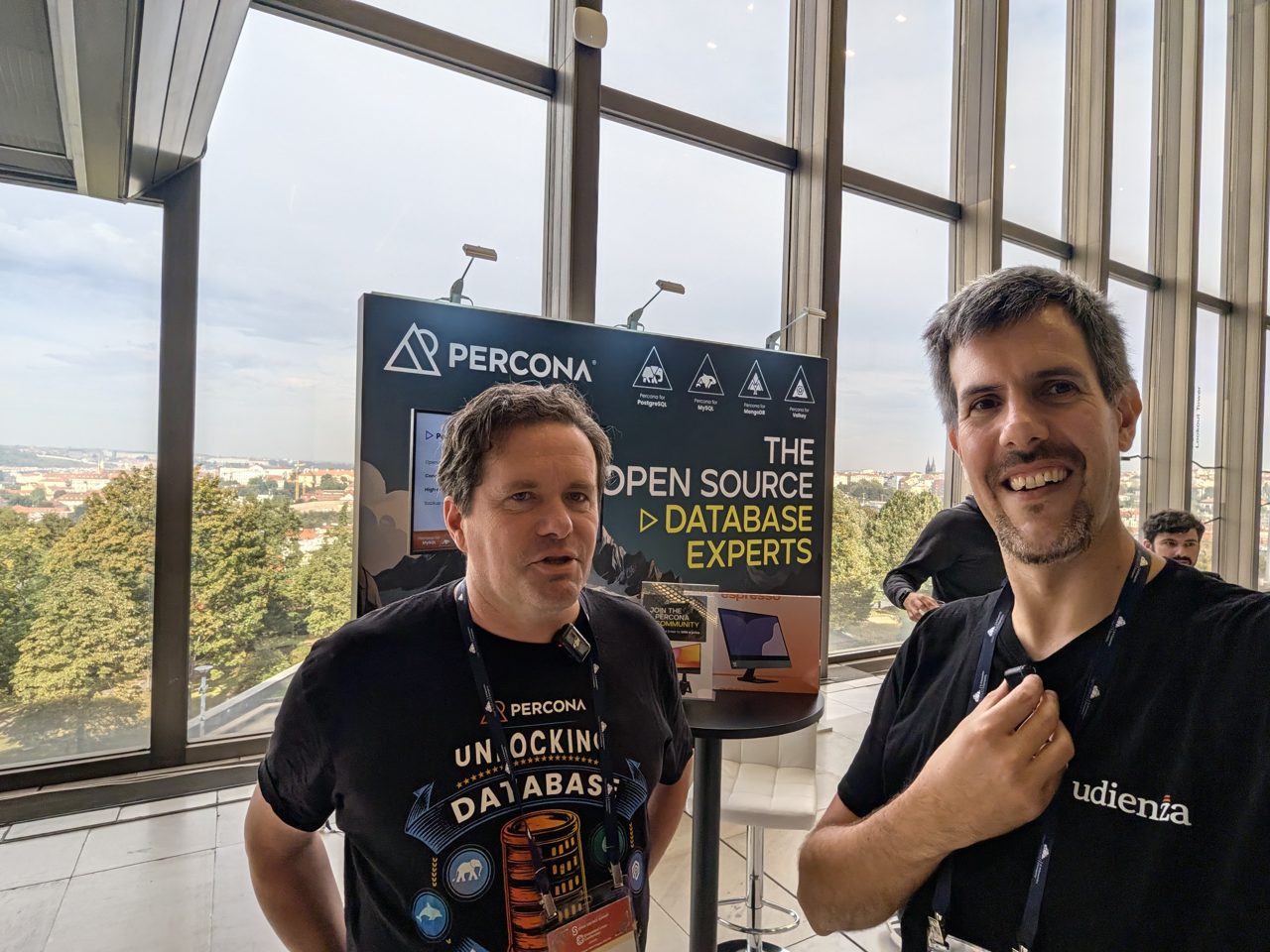 Luca Berton with a member of the Percona team at their booth