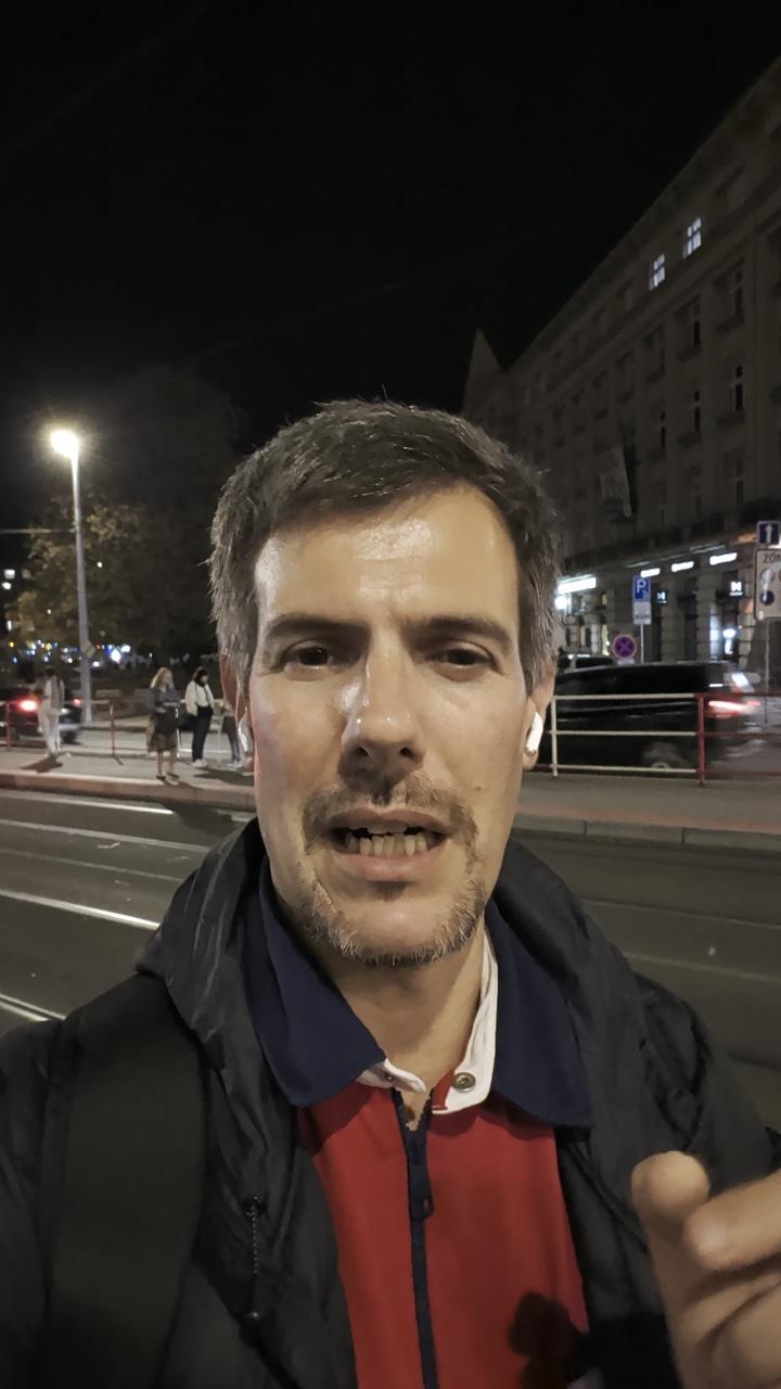 Luca Berton at a tram stop in Prague at night, October 2026