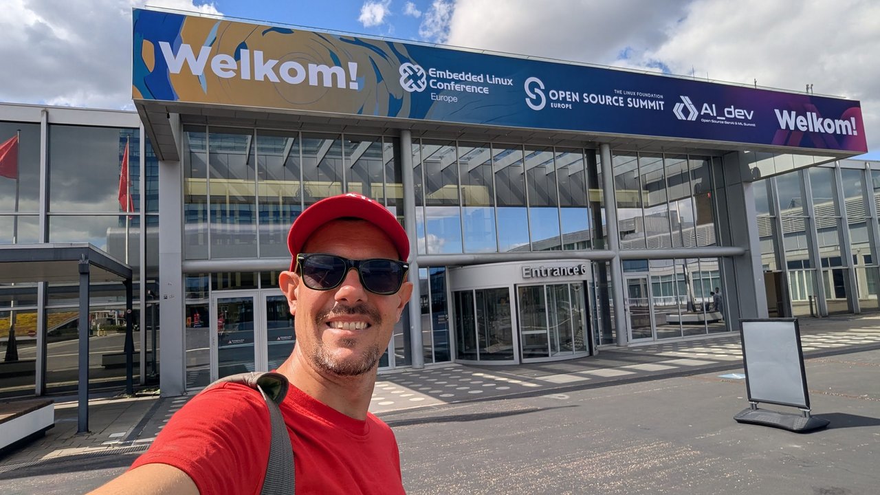 Luca Berton taking a selfie on Sunday in front of the RAI Amsterdam entrance under the Welkom banner for the Embedded Linux Conference, Open Source Summit Europe and AI_dev