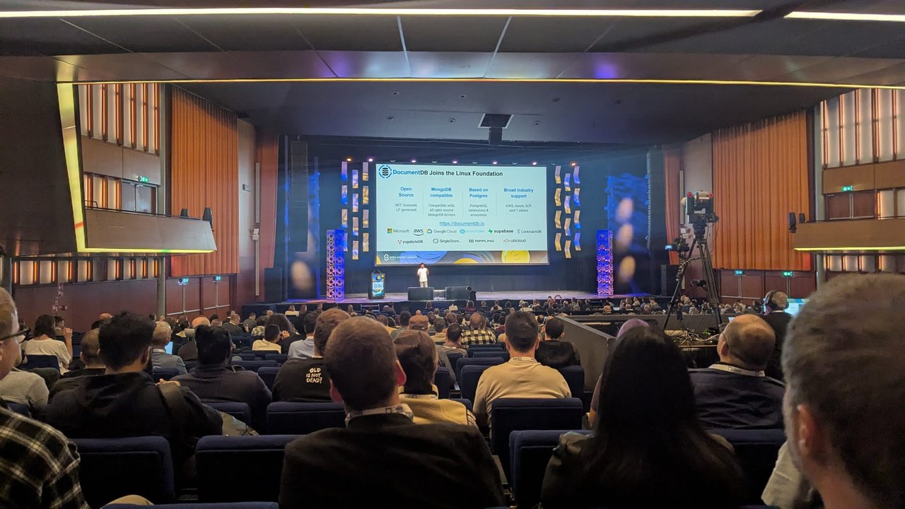 DocumentDB Joins the Linux Foundation keynote slide at Open Source Summit Europe 2025: MIT-licensed, MongoDB compatible, based on Postgres, broad industry support