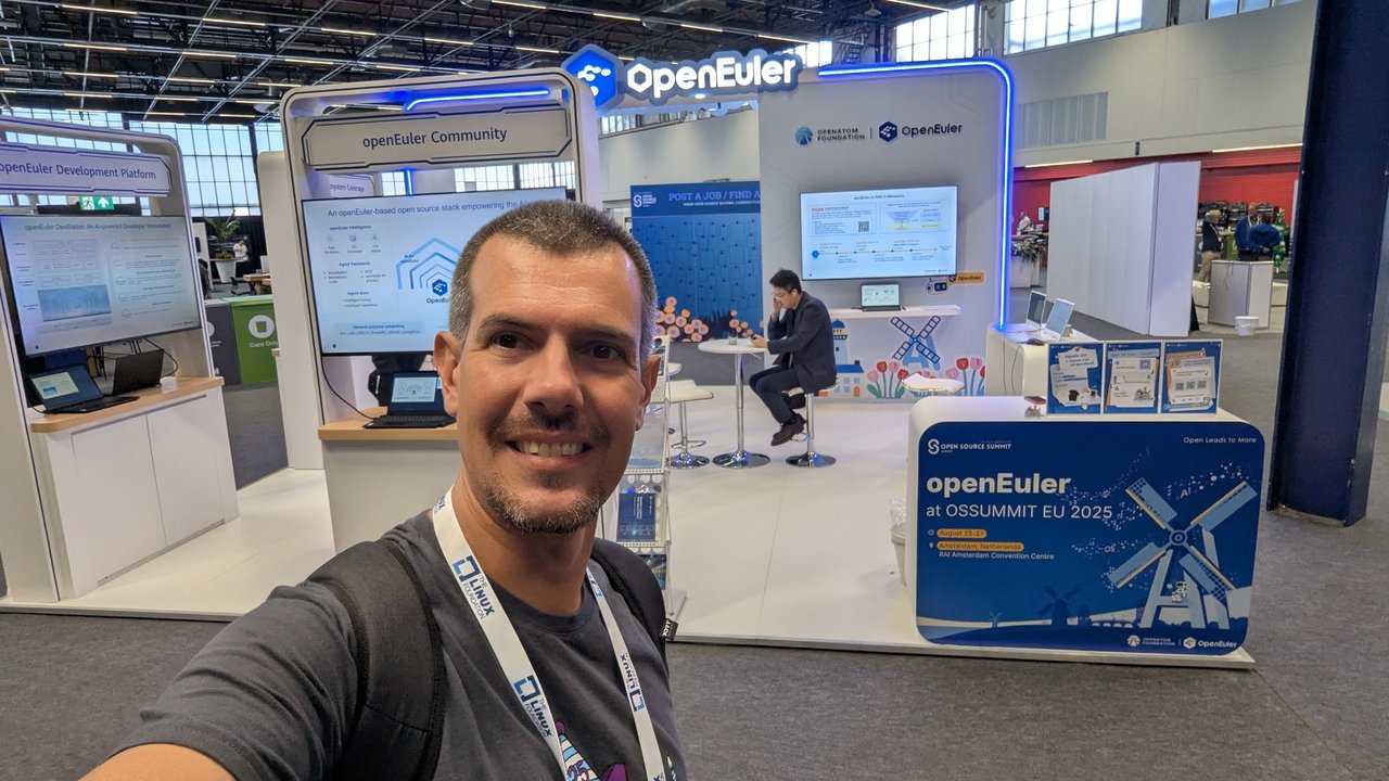 Luca Berton taking a selfie in front of the openEuler booth at Open Source Summit Europe 2025 in Amsterdam
