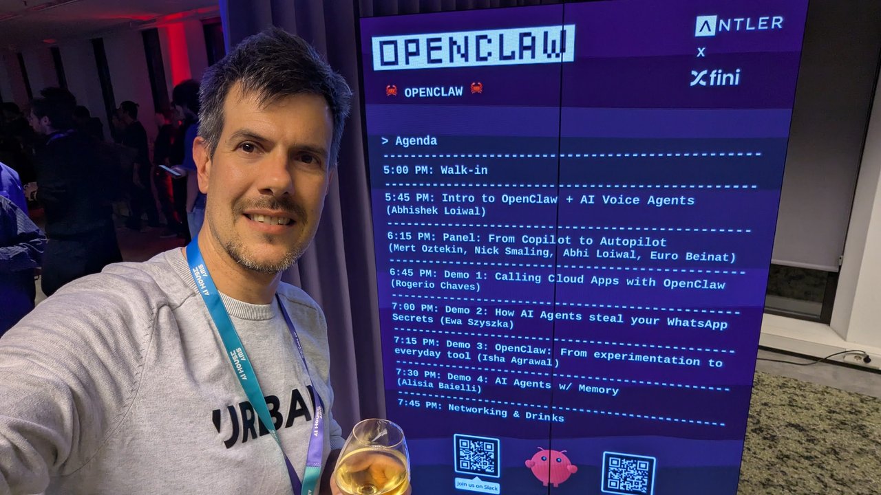 Luca Berton next to the OpenClaw agenda board at AI House Amsterdam, listing the intro, the panel and four demos