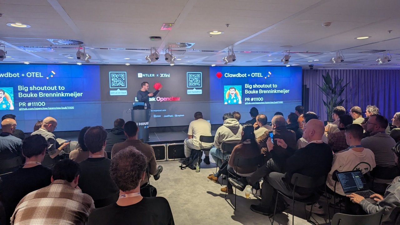 Speaker at AI House Amsterdam in front of a Clawdbot + OTEL slide crediting Bauke Brenninkmeijer for OpenClaw PR 11100