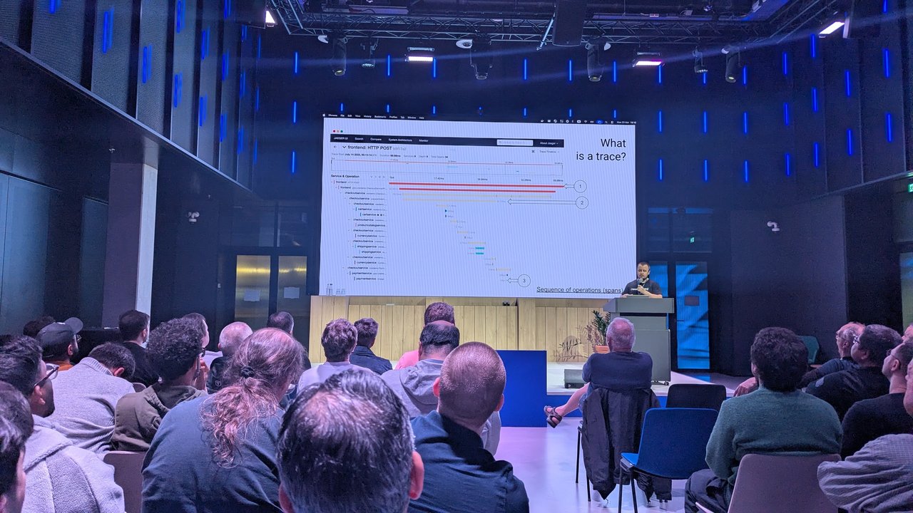 Slide titled What is a trace? at Signal Overflow at Booking.com, showing a Jaeger trace timeline of a frontend HTTP POST fanning out to checkout, cart, shipping and payment services
