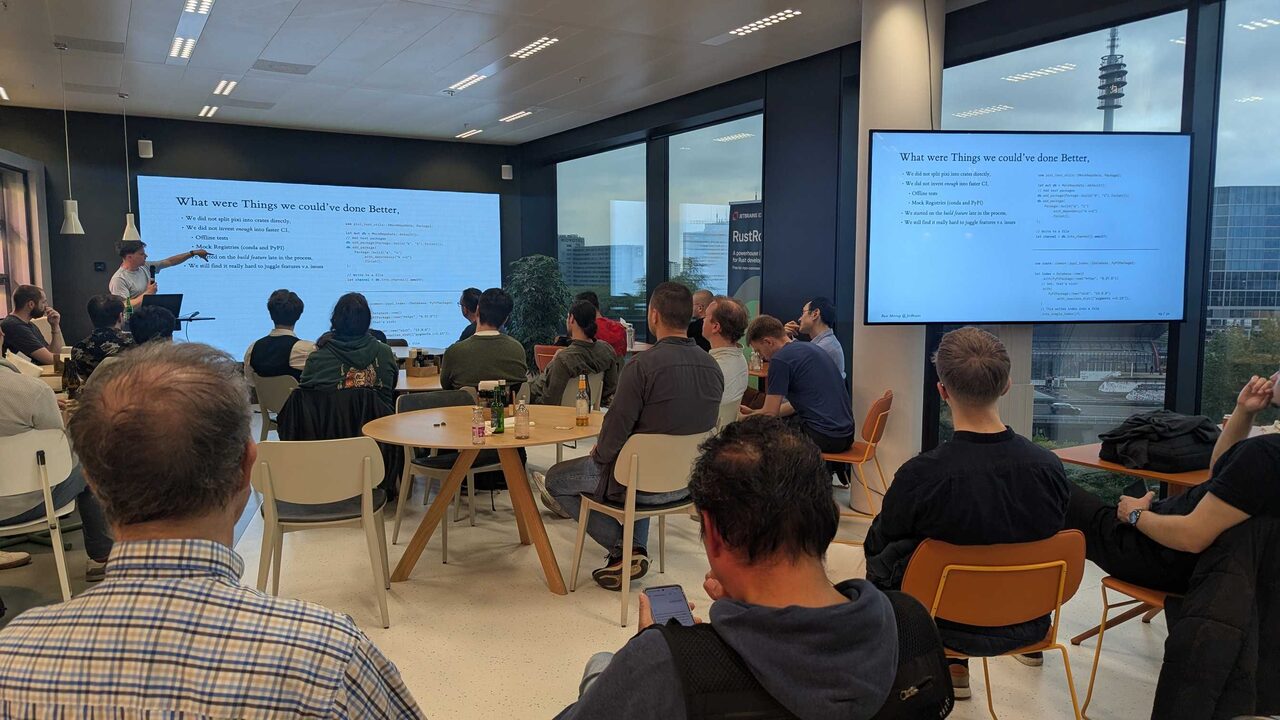 Audience during retrospective section with code on projector