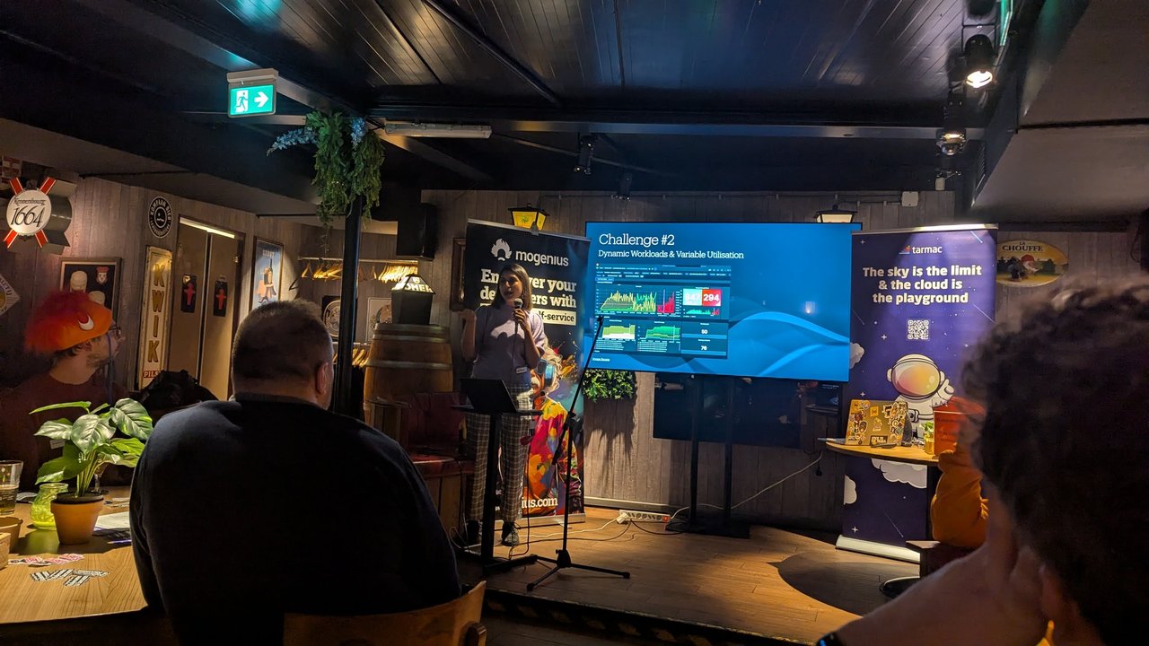 Challenge 2 Dynamic Workloads and Variable Utilisation slide with a monitoring dashboard at Platform Engineering Amsterdam