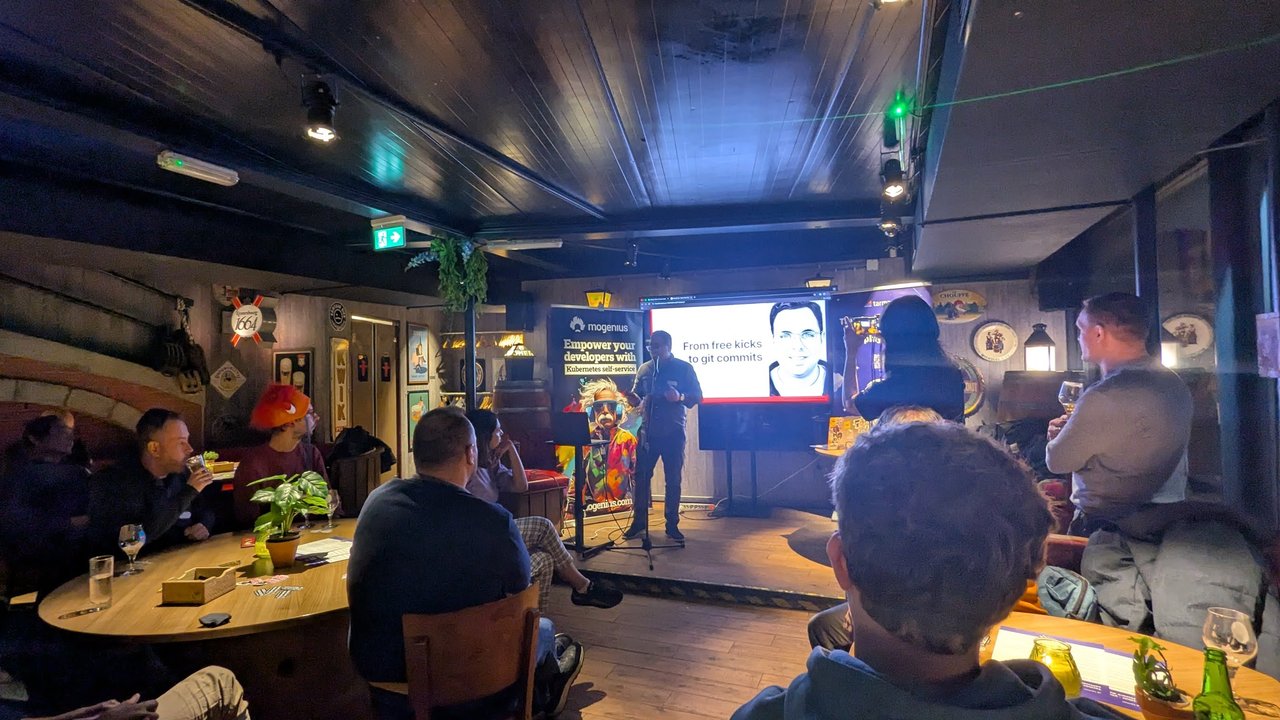 From free kicks to git commits title slide at Platform Engineering Amsterdam with the speaker on stage
