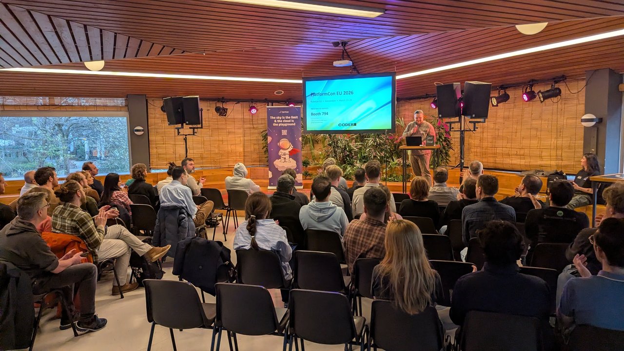 Audience in the Tolhuistuin room facing a Coder slide reading PlatformCon EU 2026, KubeCon EU, Amsterdam, March 23–26, Booth 794, next to a tarmac roll-up banner