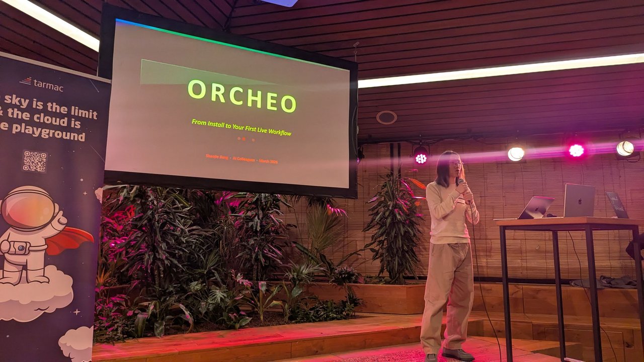Shaojie Jiang presenting the Orcheo title slide, From Install to Your First Live Workflow, beside a tarmac banner
