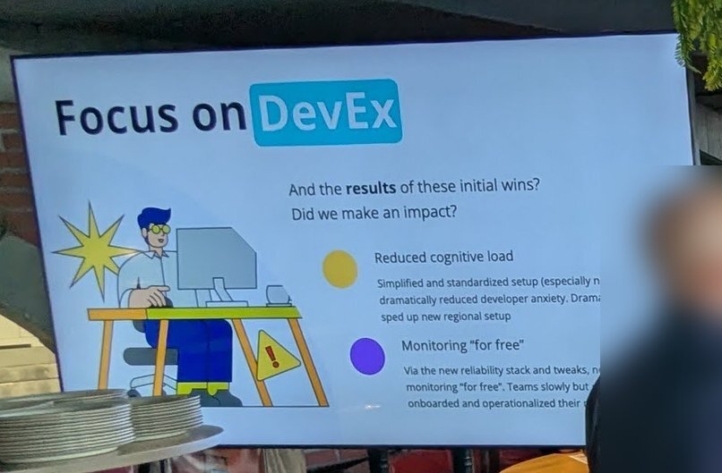 A slide titled Focus on DevEx with the results of initial wins: reduced cognitive load and monitoring for free