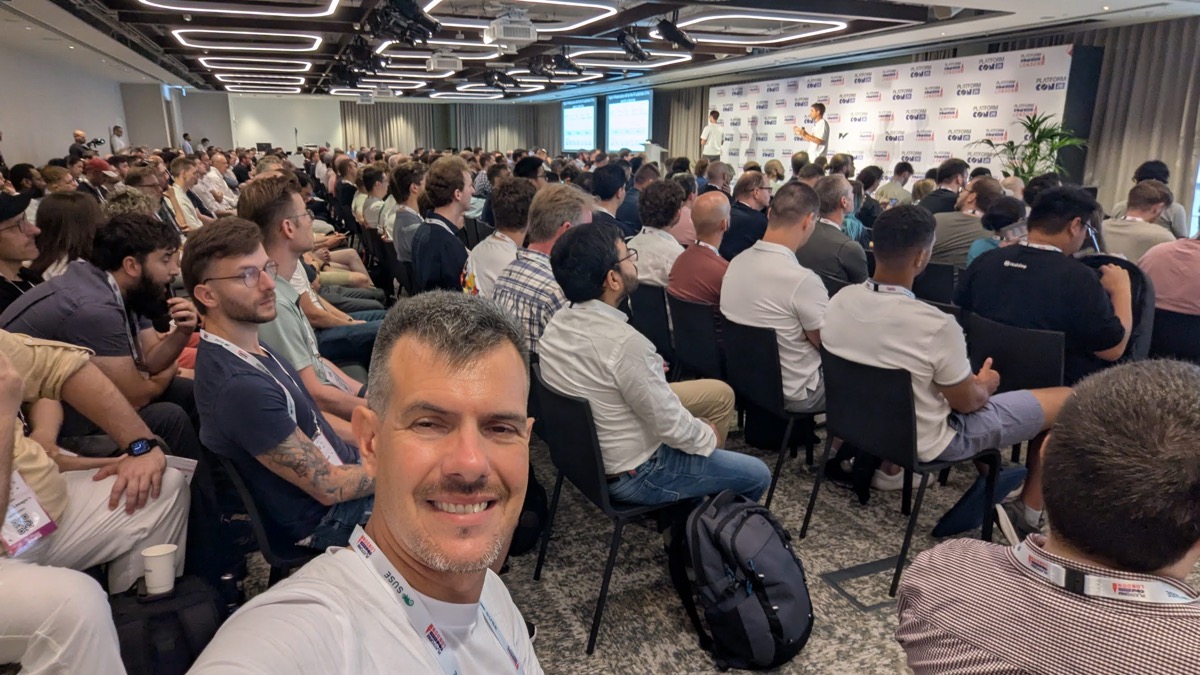 Packed main stage at PlatformCon London 2026 with attendees watching a keynote on Agentic Development Platforms