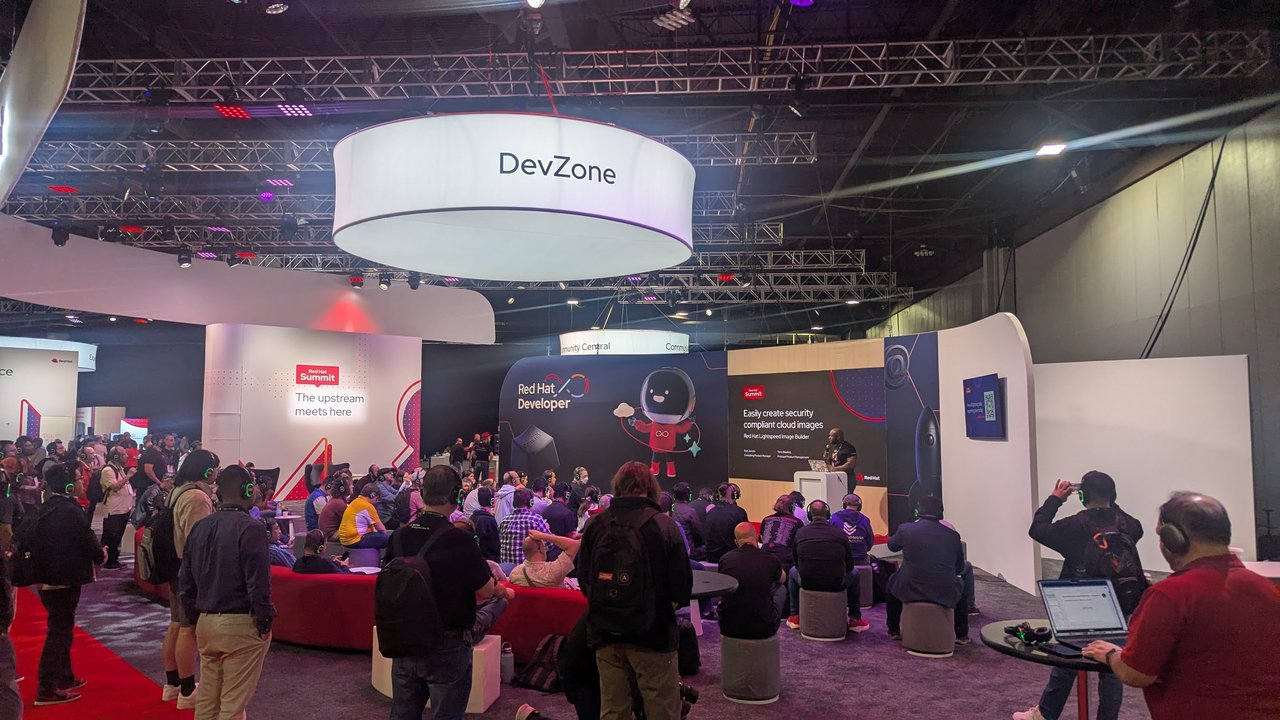 The DevZone area at Red Hat Summit 2026 with a crowd watching a session