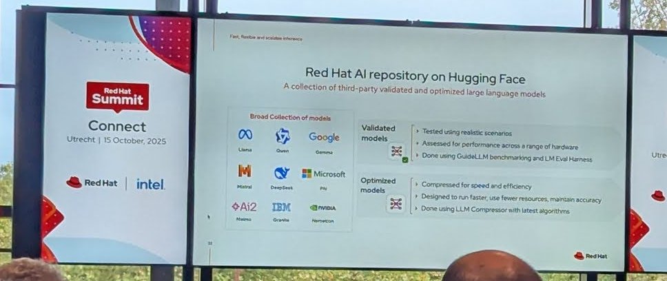 Slide titled Red Hat AI repository on Hugging Face, describing validated models tested with GuideLLM and LM Eval Harness, and optimized models compressed with LLM Compressor