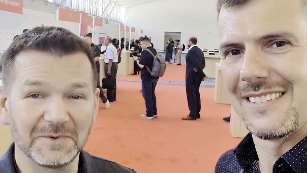 Luca Berton talking with Alan Fewell, Red Hat, the night before his own lightning talk at Red Hat Summit 2026