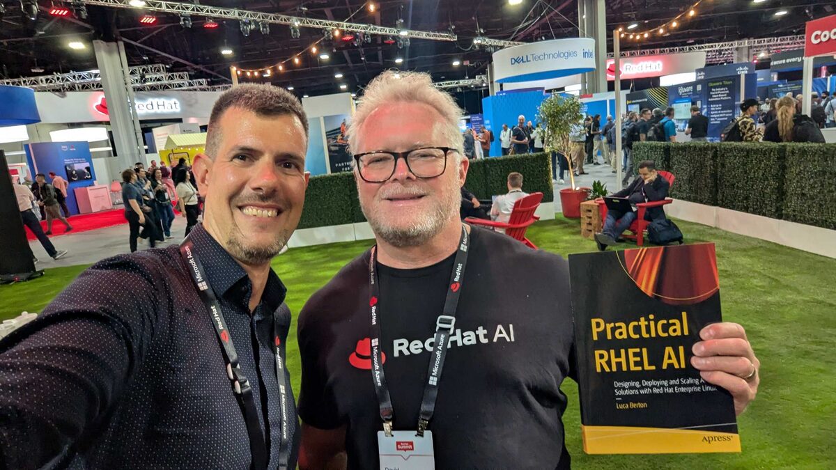 Red Hat AI team member with Practical RHEL AI on the show floor