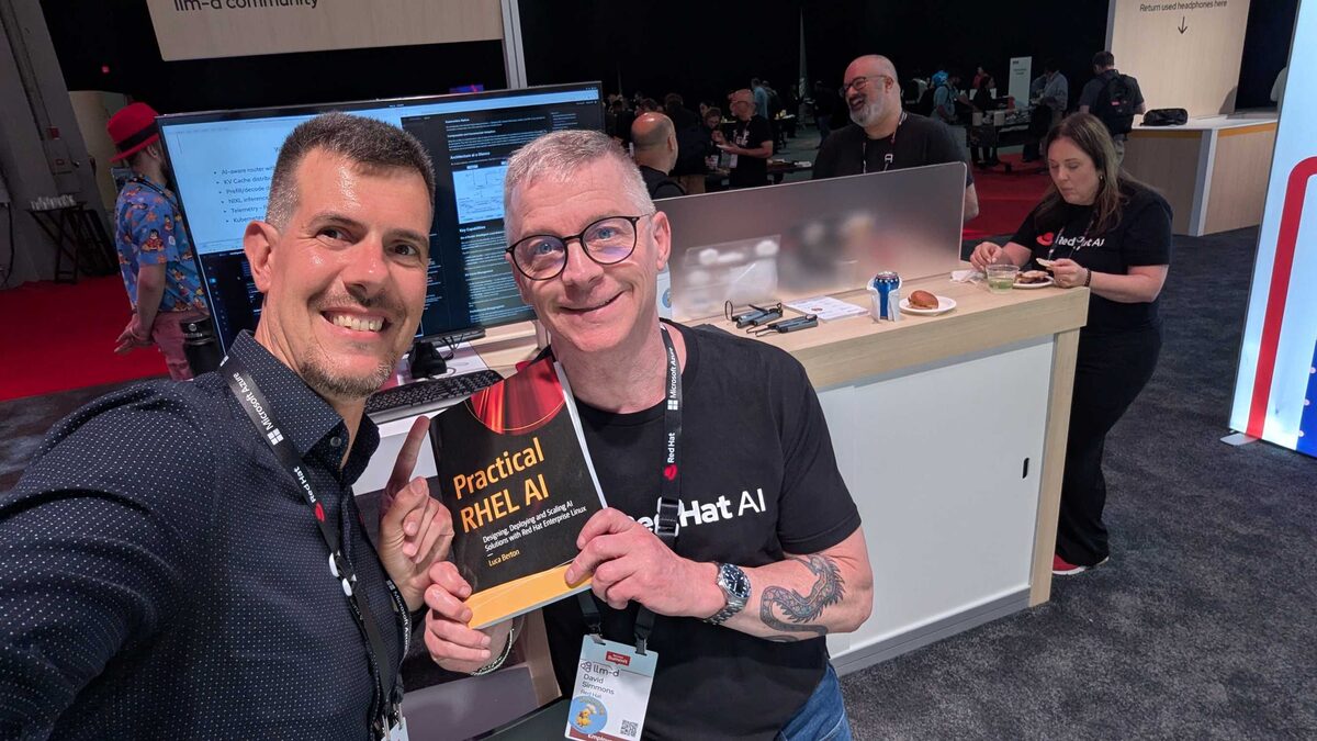 Luca Berton with David from Red Hat at the llm-d community booth