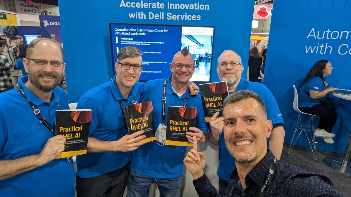 Dell Services team with four copies of Practical RHEL AI