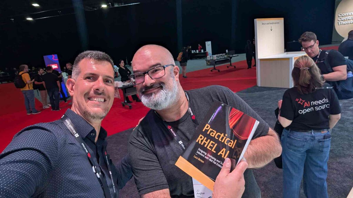 Luca at the CentOS Special Interest Groups booth with Practical RHEL AI