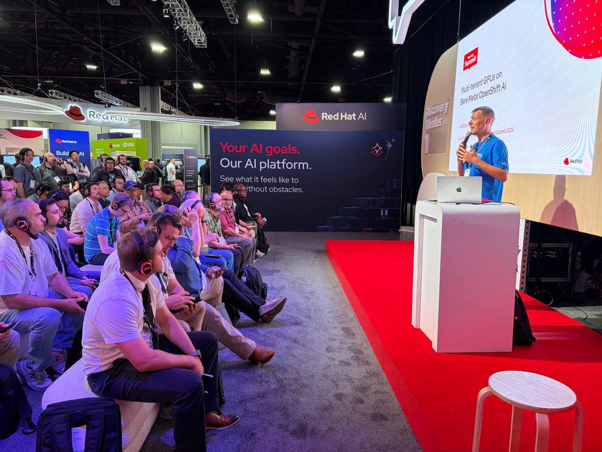 Luca Berton presenting to a packed Discovery Theater at Red Hat Summit 2026 — Red Hat AI stage