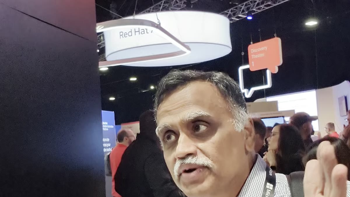 Madhu, Red Hat, demonstrating Event-Driven Ansible at the Ansible booth at Red Hat Summit 2026