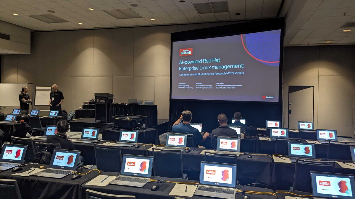Wide shot of the hands-on lab room — dozens of stations ready for attendees
