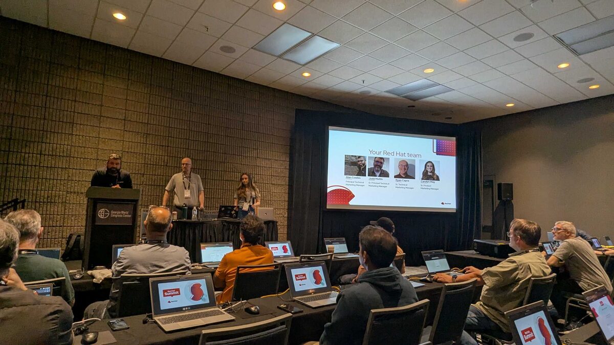 Packed room at Georgia World Congress Center — attendees with laptops ready for hands-on labs
