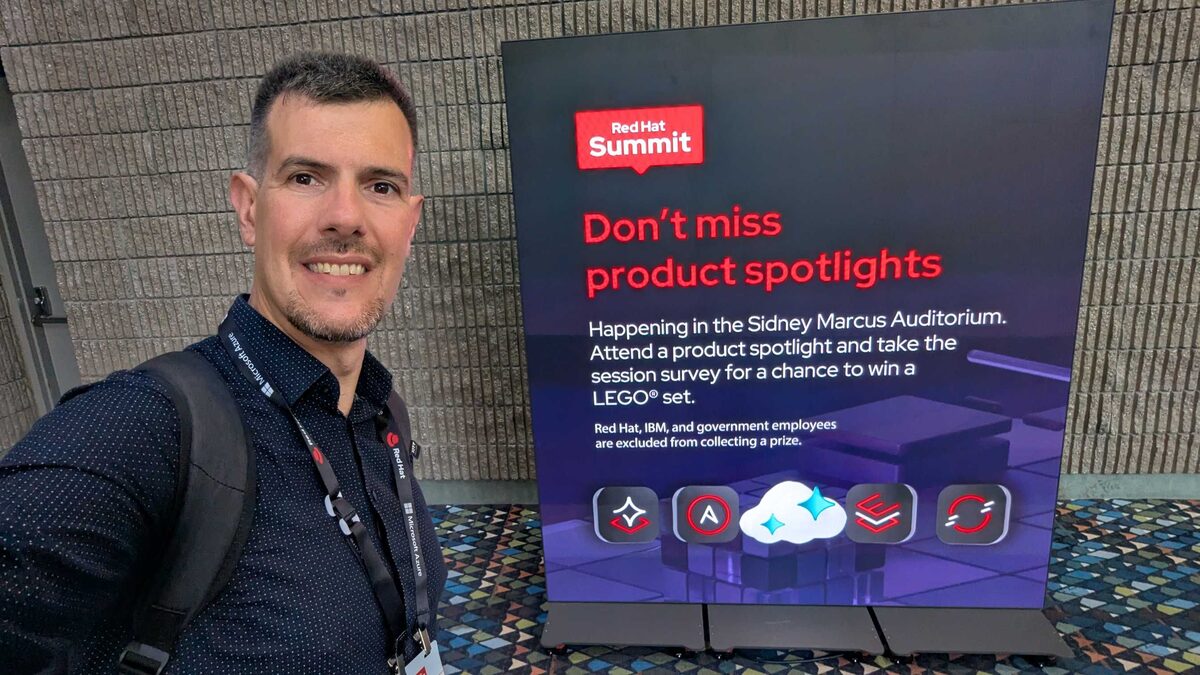Luca Berton at Red Hat Summit 2026 — Product Spotlights sign with RHEL, Ansible, OpenShift, and more