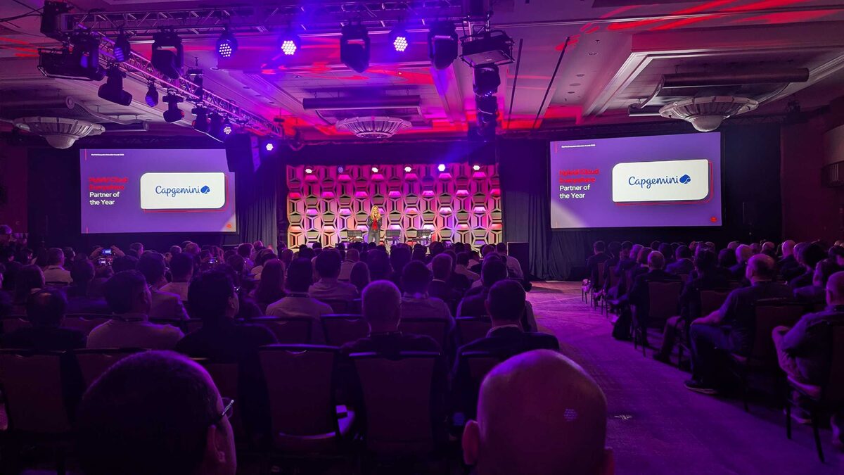 Luca Berton selfie at Red Hat Summit 2026 Partner Keynote with packed ballroom