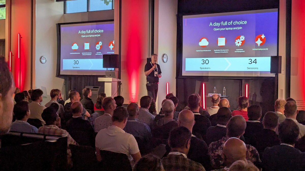 Event stats slide — 30 speakers, 34 sessions, four pillars