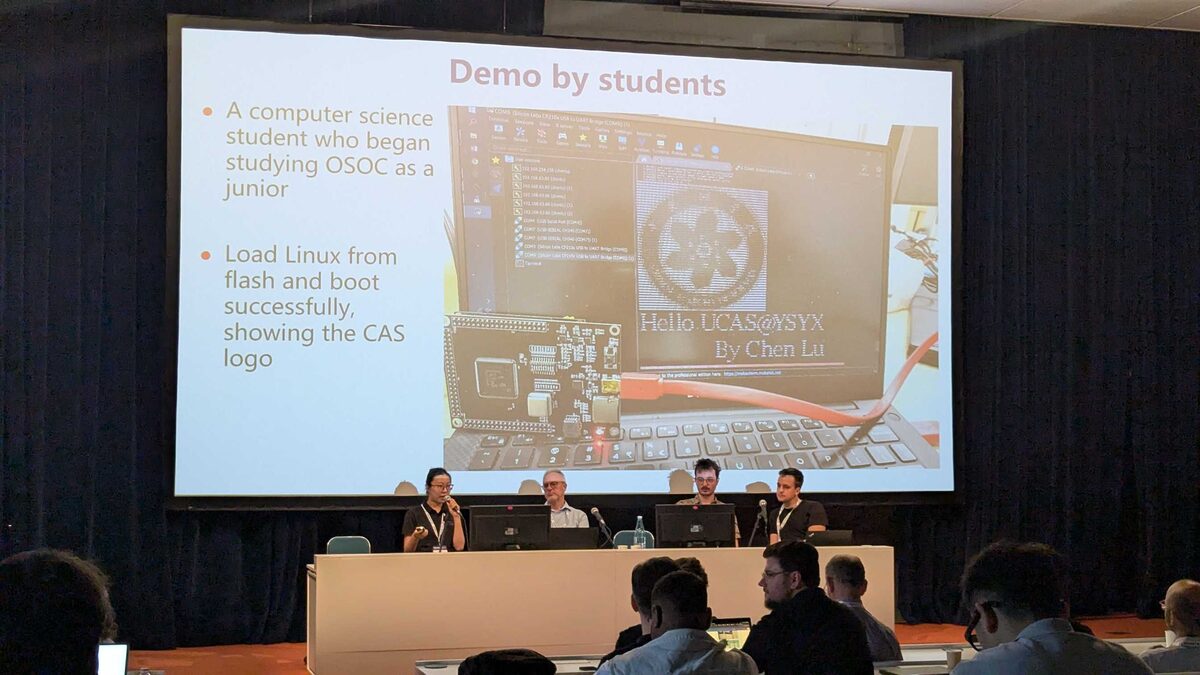 Demo by students — Chen Lu boots Linux from flash showing CAS logo on OSOC chip