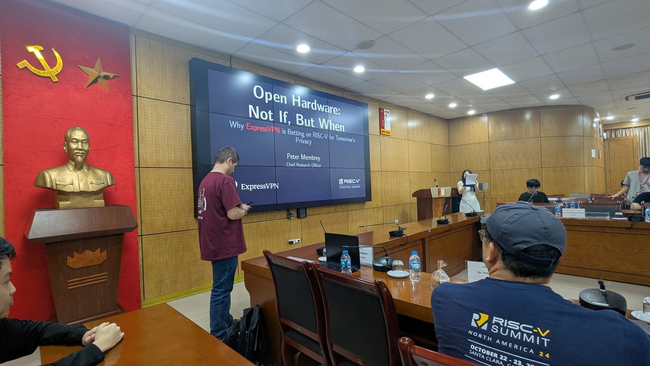 The Open Hardware: Not If, But When title slide with the ExpressVPN logo and the speaker standing in front of it